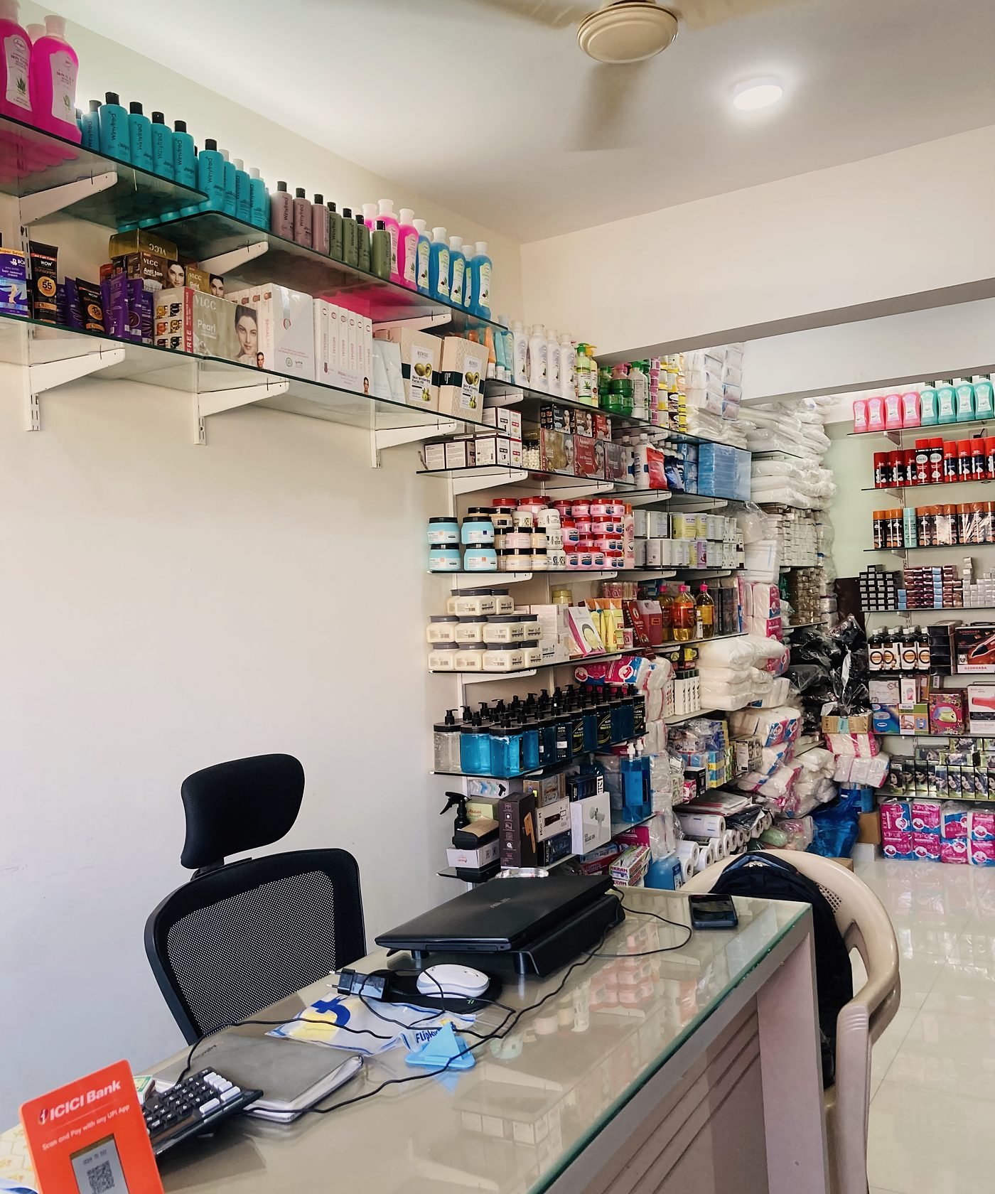 The billing counter with shelves of beauty products behind it